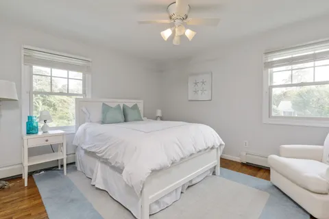 a bedroom with a large bed and a couch