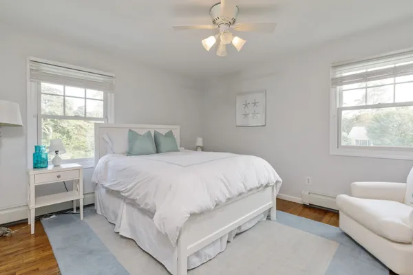 a bedroom with a large bed and a couch