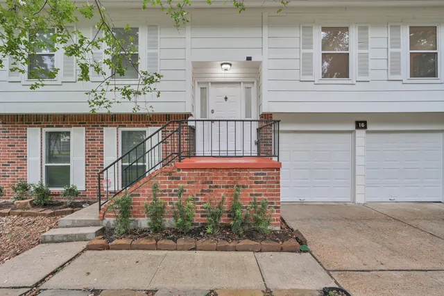 a view of a brick building with many windows