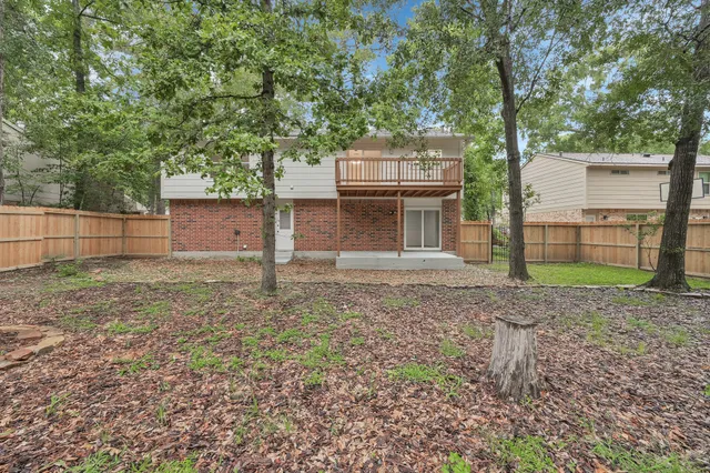 a house view with a backyard space