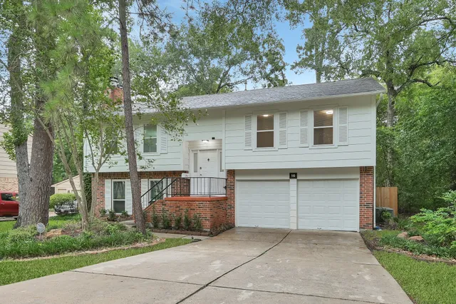 front view of a house with a garden