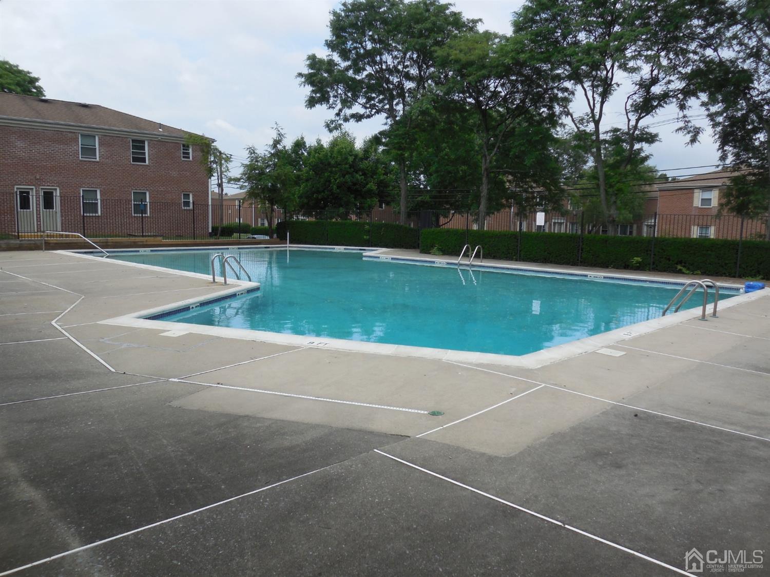 50 Fox Road, Unit 1A Edison, NJ 08817 - Photo 3 of 3 a view of a tennis court with a house in the background