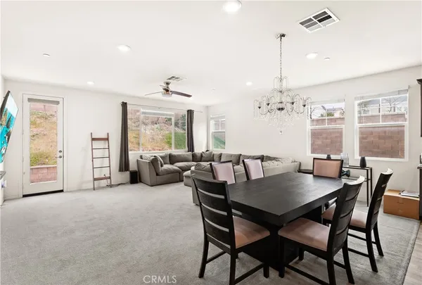 a view of a dining room with furniture window and outside view