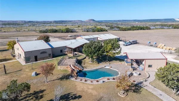 an aerial view of a house with a lake view