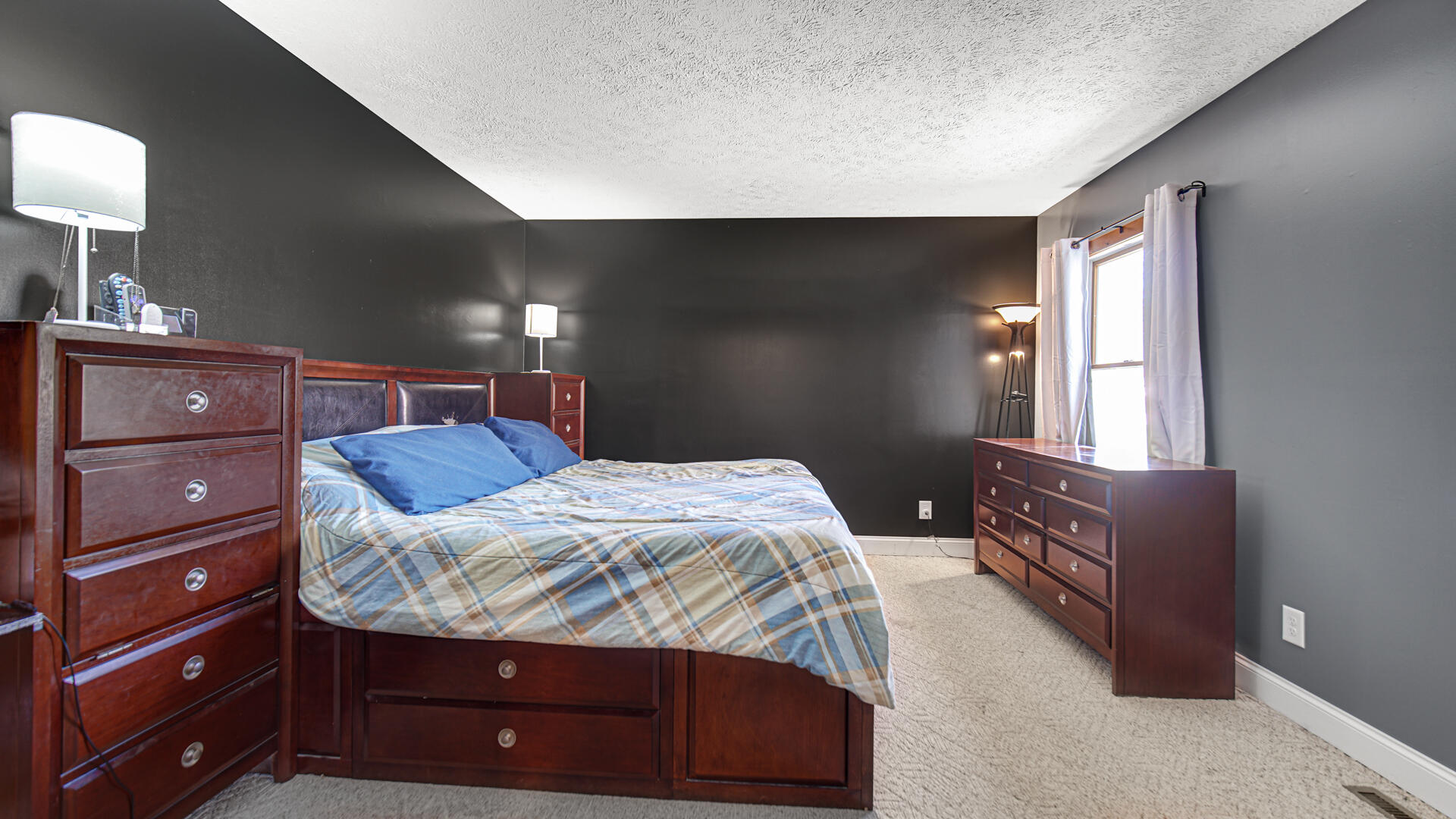 324 West Johnson Road La Porte, IN 46350 - Photo 13 of 34 a bedroom with a bed and a dresser