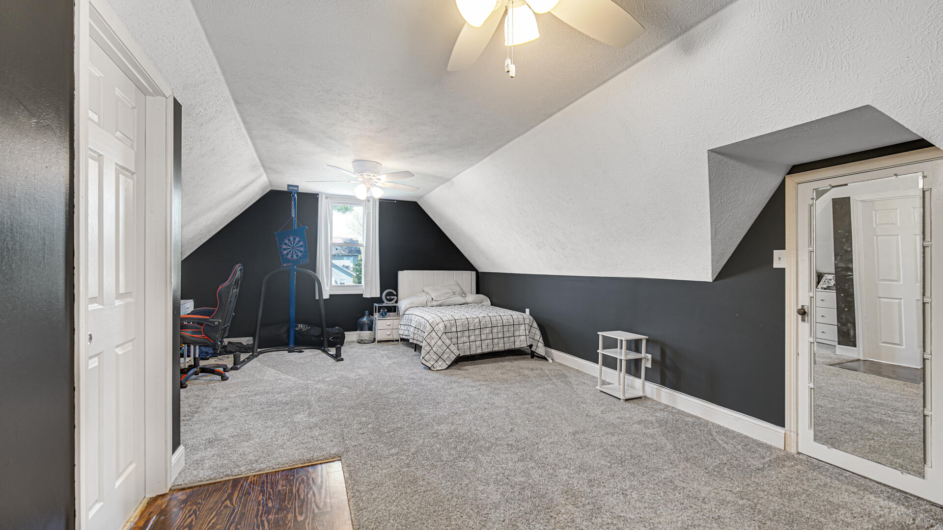 324 West Johnson Road La Porte, IN 46350 - Photo 22 of 34 a hallway with furniture and a ceiling fan