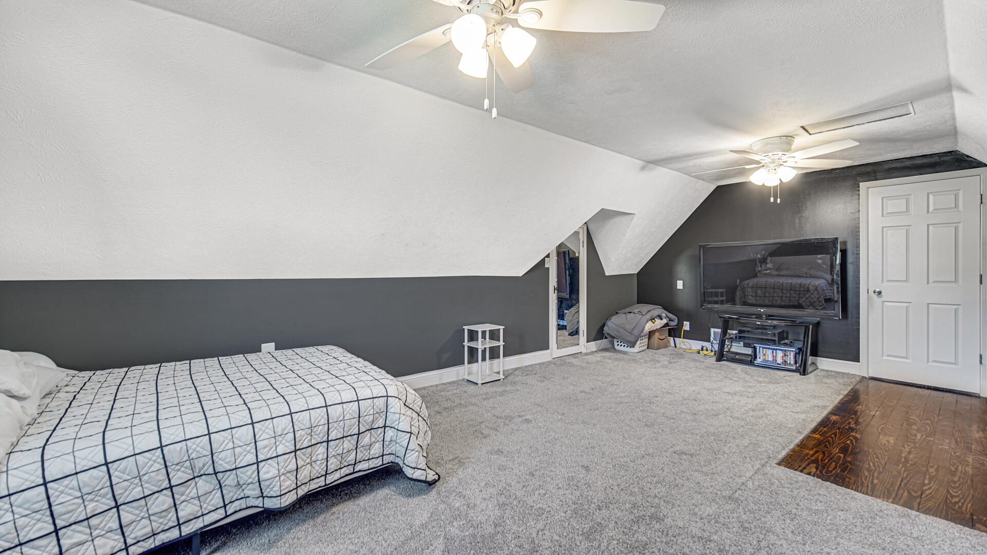 324 West Johnson Road La Porte, IN 46350 - Photo 23 of 34 a bedroom with a bed a chandelier and a dresser