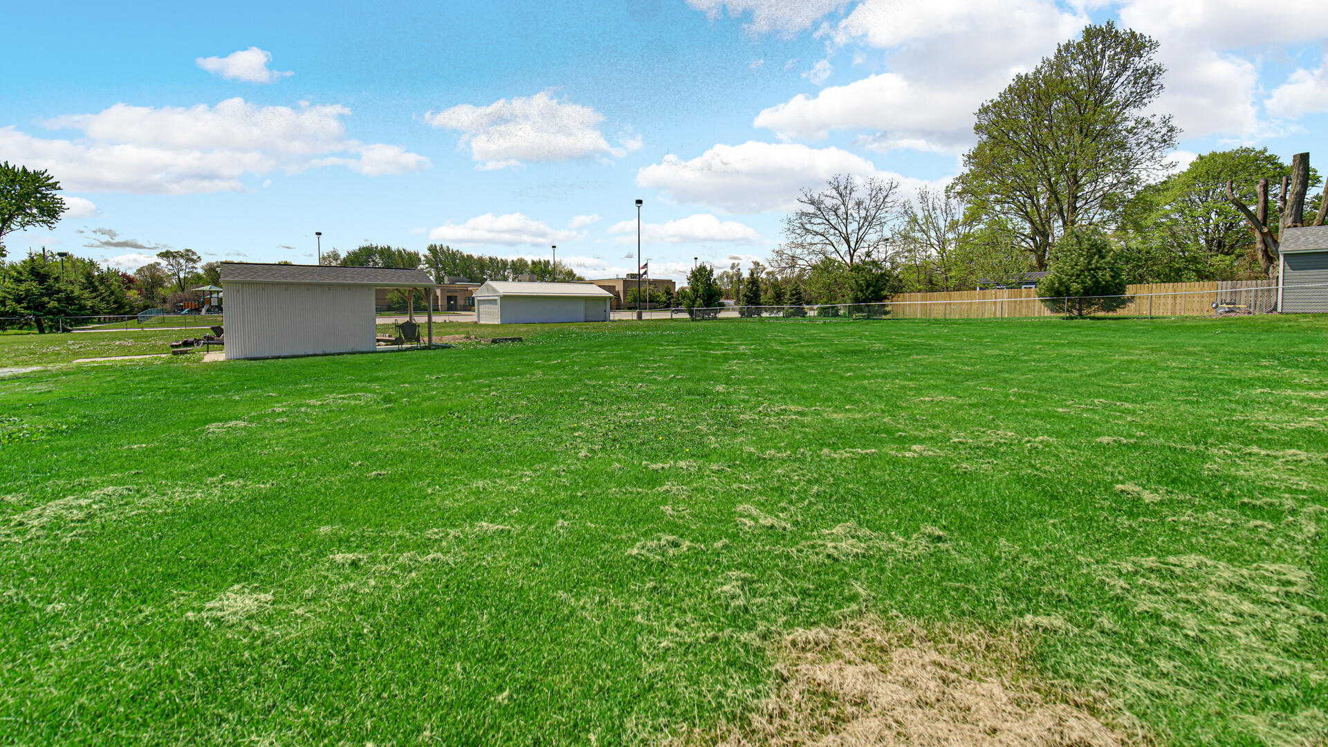 324 West Johnson Road La Porte, IN 46350 - Photo 29 of 34 a view of a garden with a building in the background