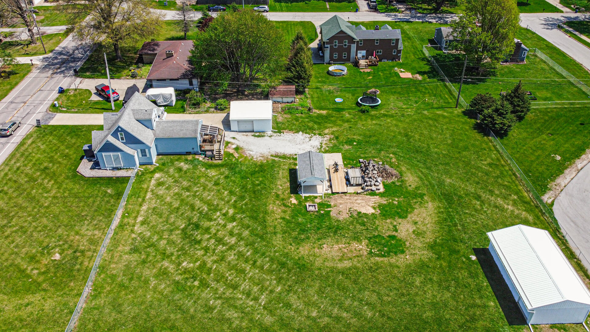 324 West Johnson Road La Porte, IN 46350 - Photo 6 of 34 a backyard of a house with lots of green space and garden