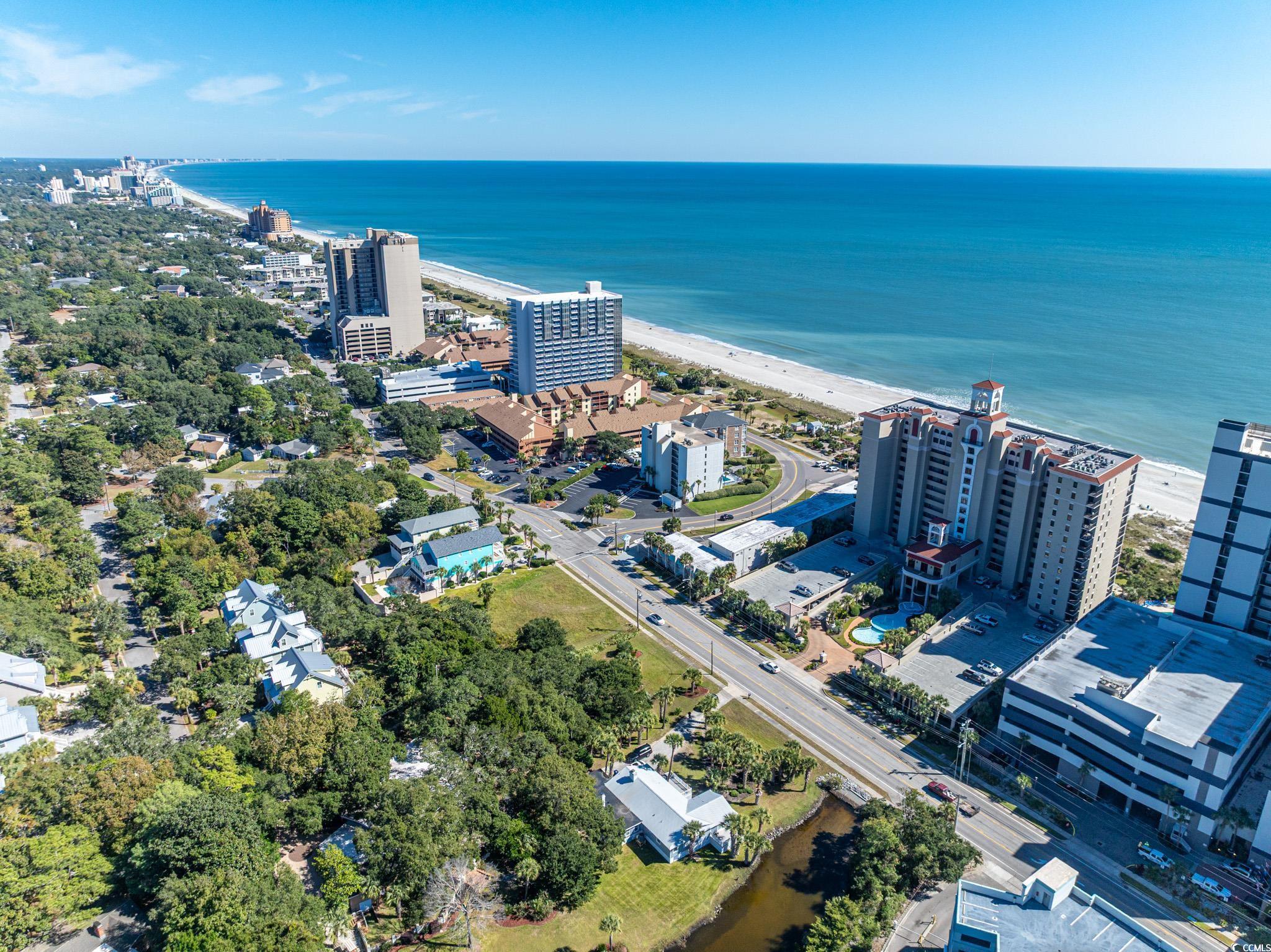 5307 North Ocean Boulevard Myrtle Beach, SC 29577 - Photo 2 of 39 View of urban area with waterfront with a beach