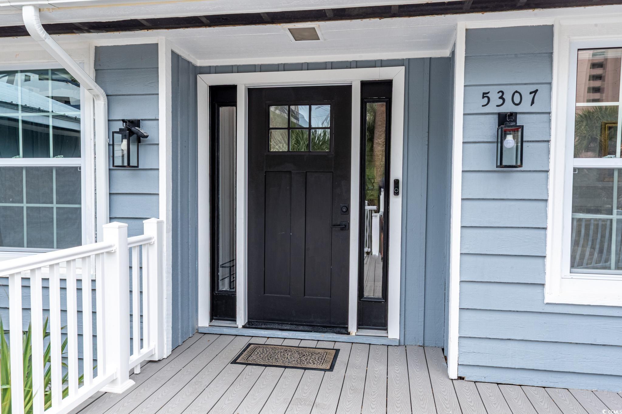 5307 North Ocean Boulevard Myrtle Beach, SC 29577 - Photo 5 of 39 Entrance to property featuring covered porch