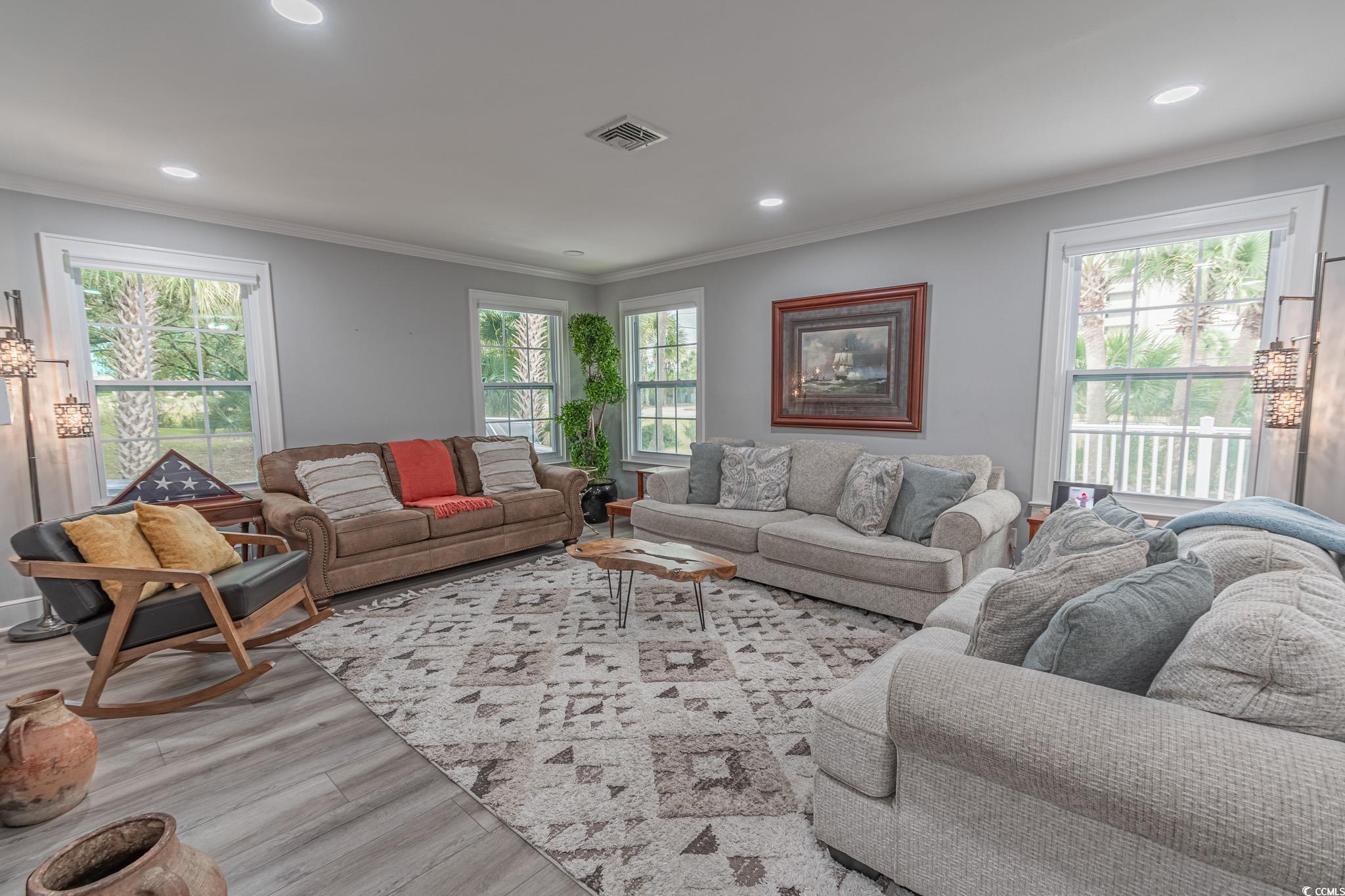 5307 North Ocean Boulevard Myrtle Beach, SC 29577 - Photo 8 of 39 Living area featuring crown molding, wood finished floors, and recessed lighting