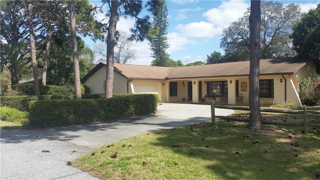 431 Carmel Road Venice, FL 34293 - Photo 1 of 1 a view of a house with a yard