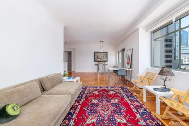 a living room with furniture and a rug
