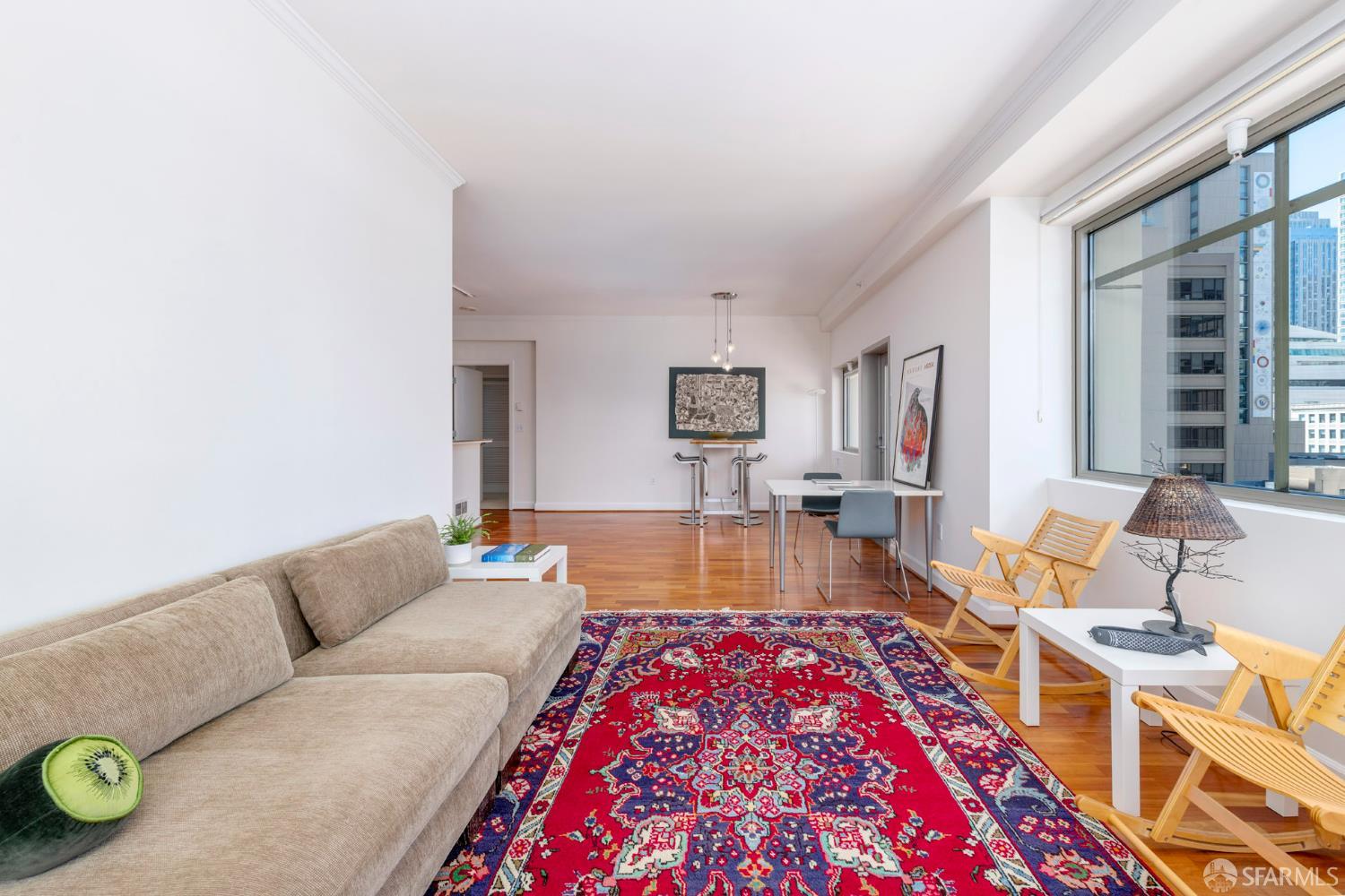 246 2nd Street, Unit 703 San Francisco, CA 94105 - Photo 13 of 30 a living room with furniture and a rug