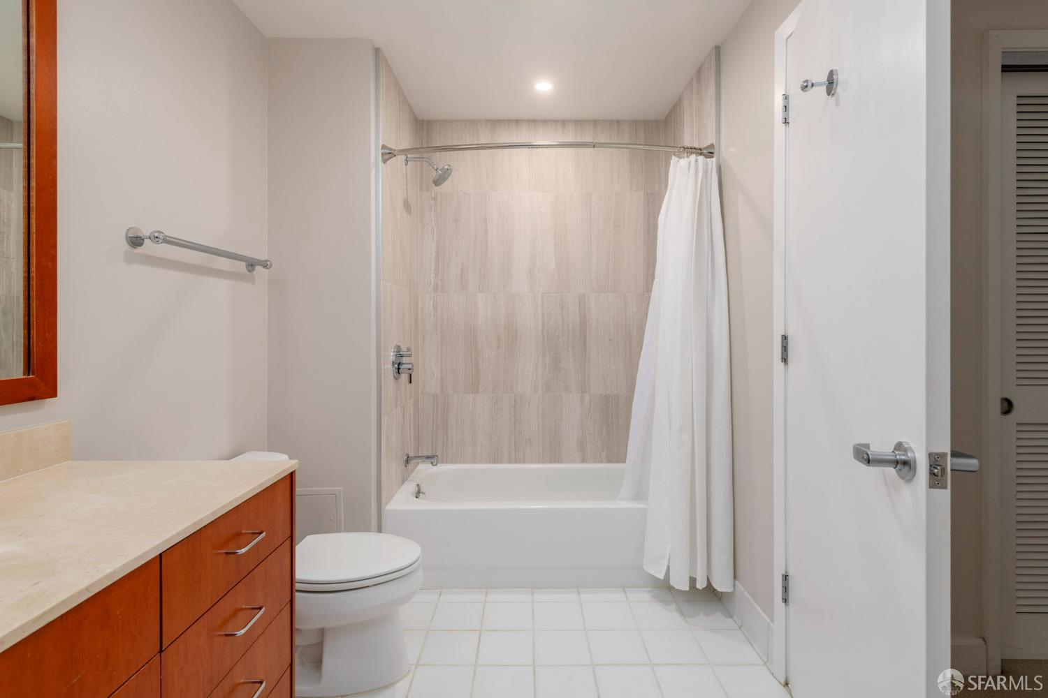 246 2nd Street, Unit 703 San Francisco, CA 94105 - Photo 21 of 30 a bathroom with a shower a toilet and a sink