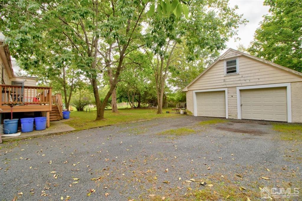 38 Hamilton Road Hillsborough, NJ 08844 - Photo 3 of 28 a view of backyard of house with large trees