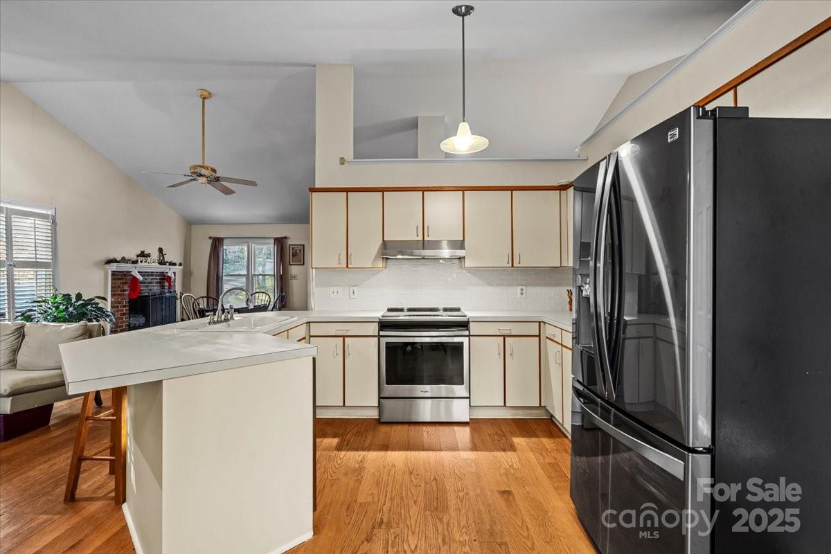7022 Plott Road Charlotte, NC 28215 - Photo 12 of 27 a kitchen with a refrigerator a sink and a stove