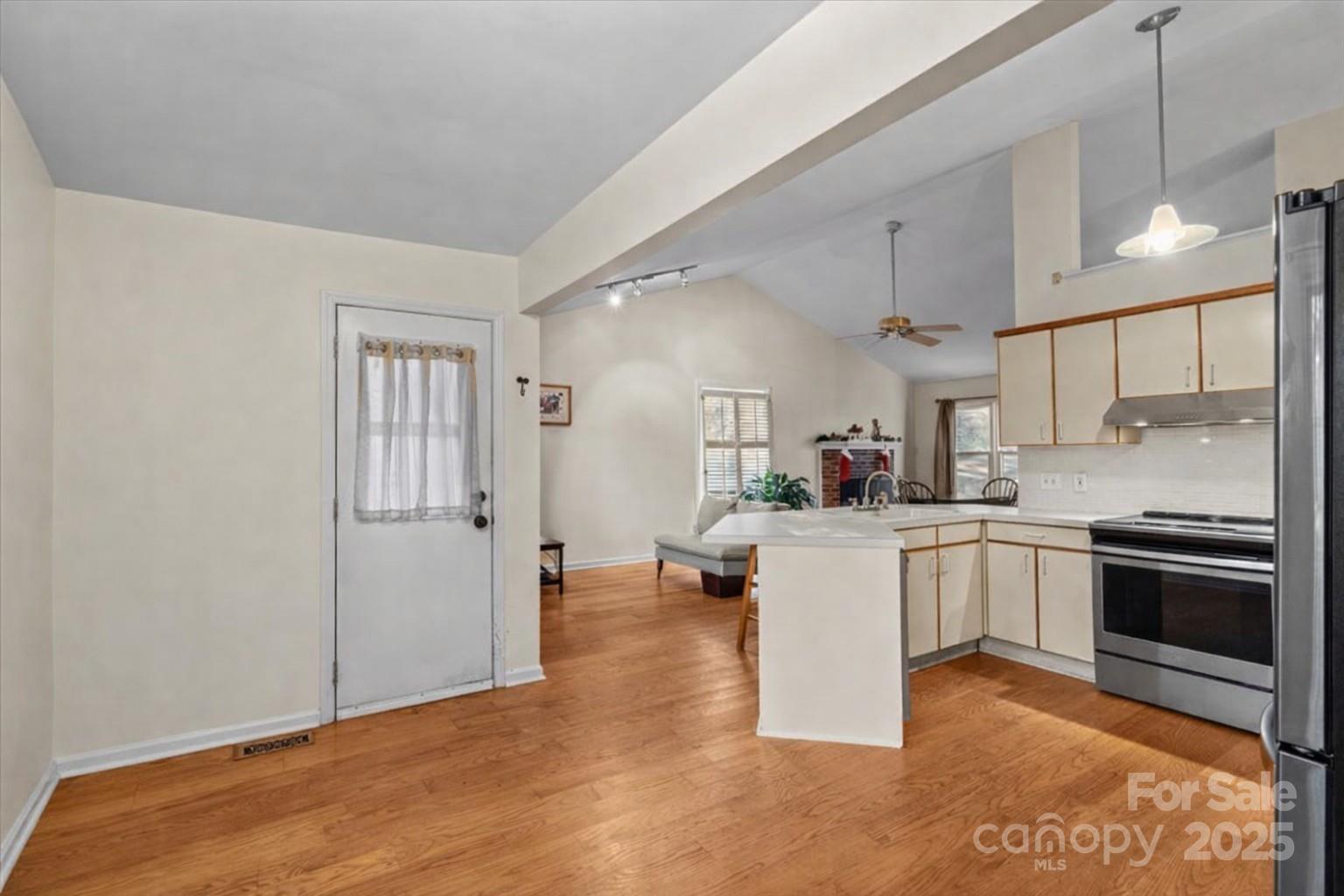 7022 Plott Road Charlotte, NC 28215 - Photo 13 of 27 a kitchen with a sink cabinets and stainless steel appliances