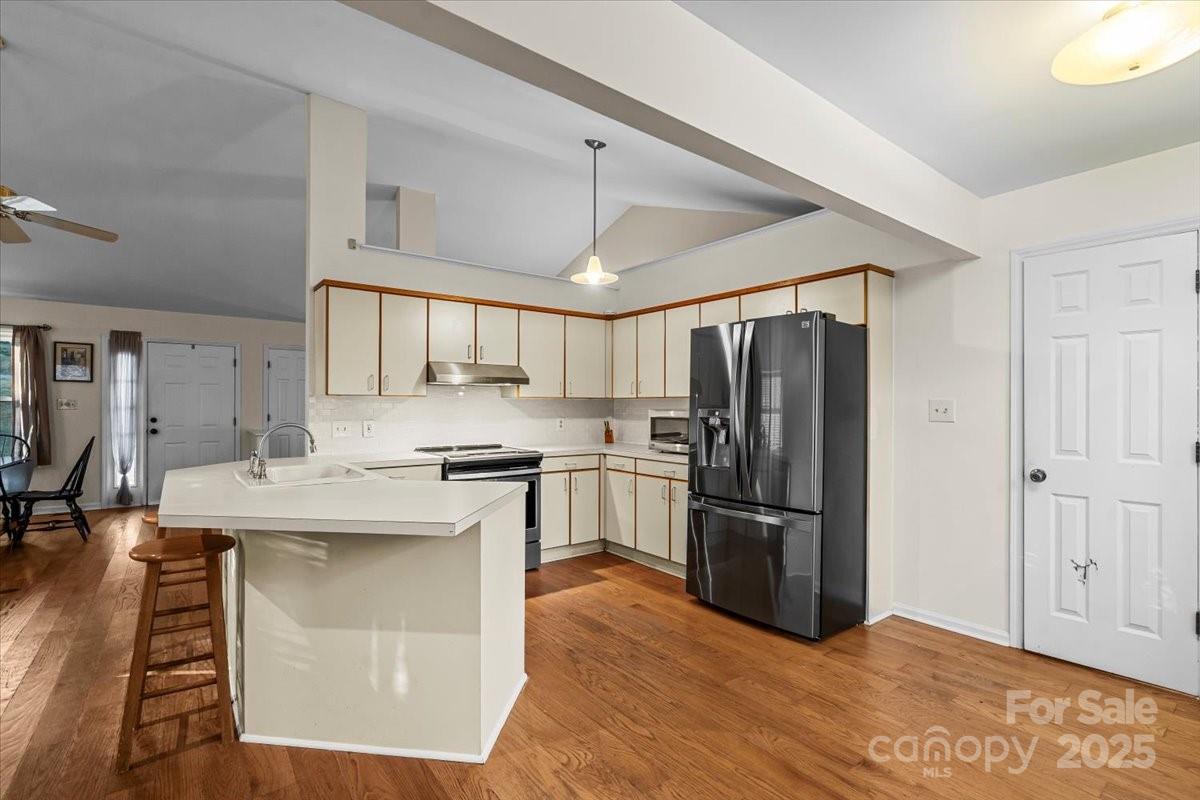 7022 Plott Road Charlotte, NC 28215 - Photo 14 of 27 a kitchen with stainless steel appliances granite countertop a refrigerator a stove and a sink