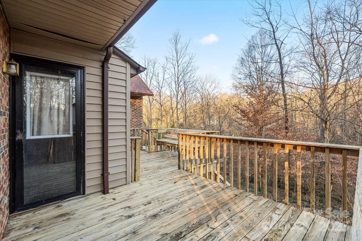 7022 Plott Road Charlotte, NC 28215 - Photo 15 of 27 a view of a balcony with wooden floor and fence and floor