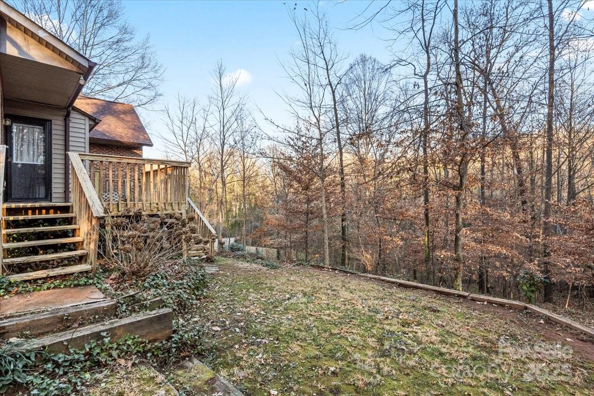 7022 Plott Road Charlotte, NC 28215 - Photo 16 of 27 a view of a house with a yard