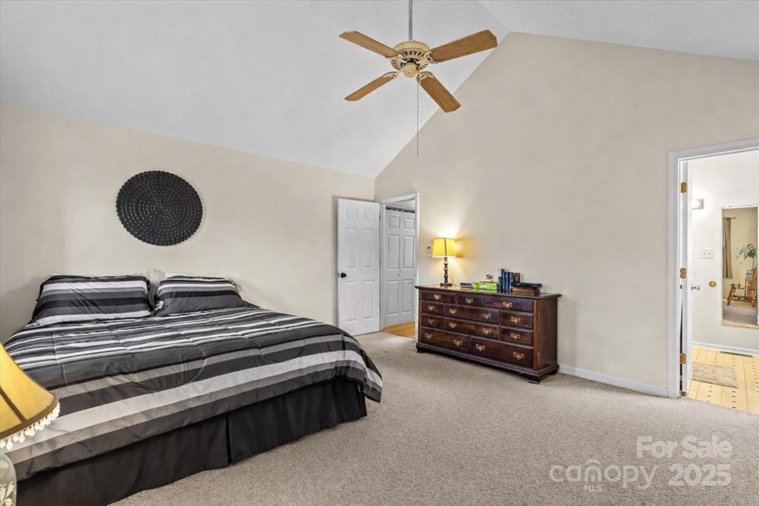 7022 Plott Road Charlotte, NC 28215 - Photo 17 of 27 a bedroom with a bed and cabinets