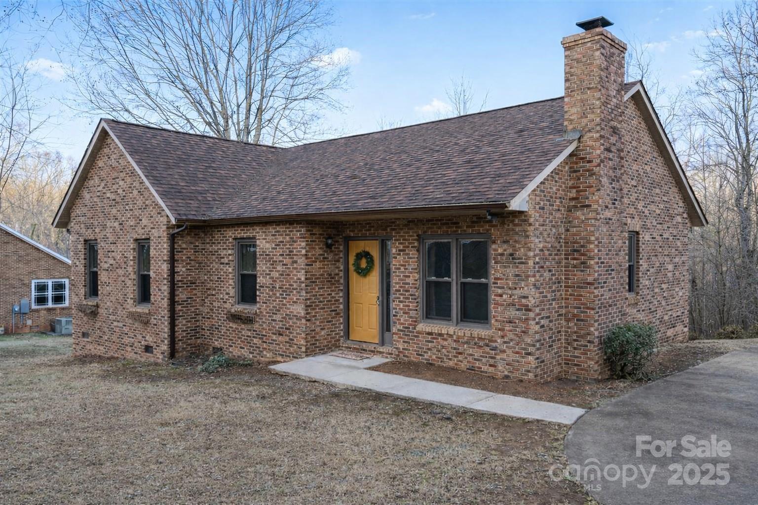 7022 Plott Road Charlotte, NC 28215 - Photo 2 of 27 a front view of a house with garden