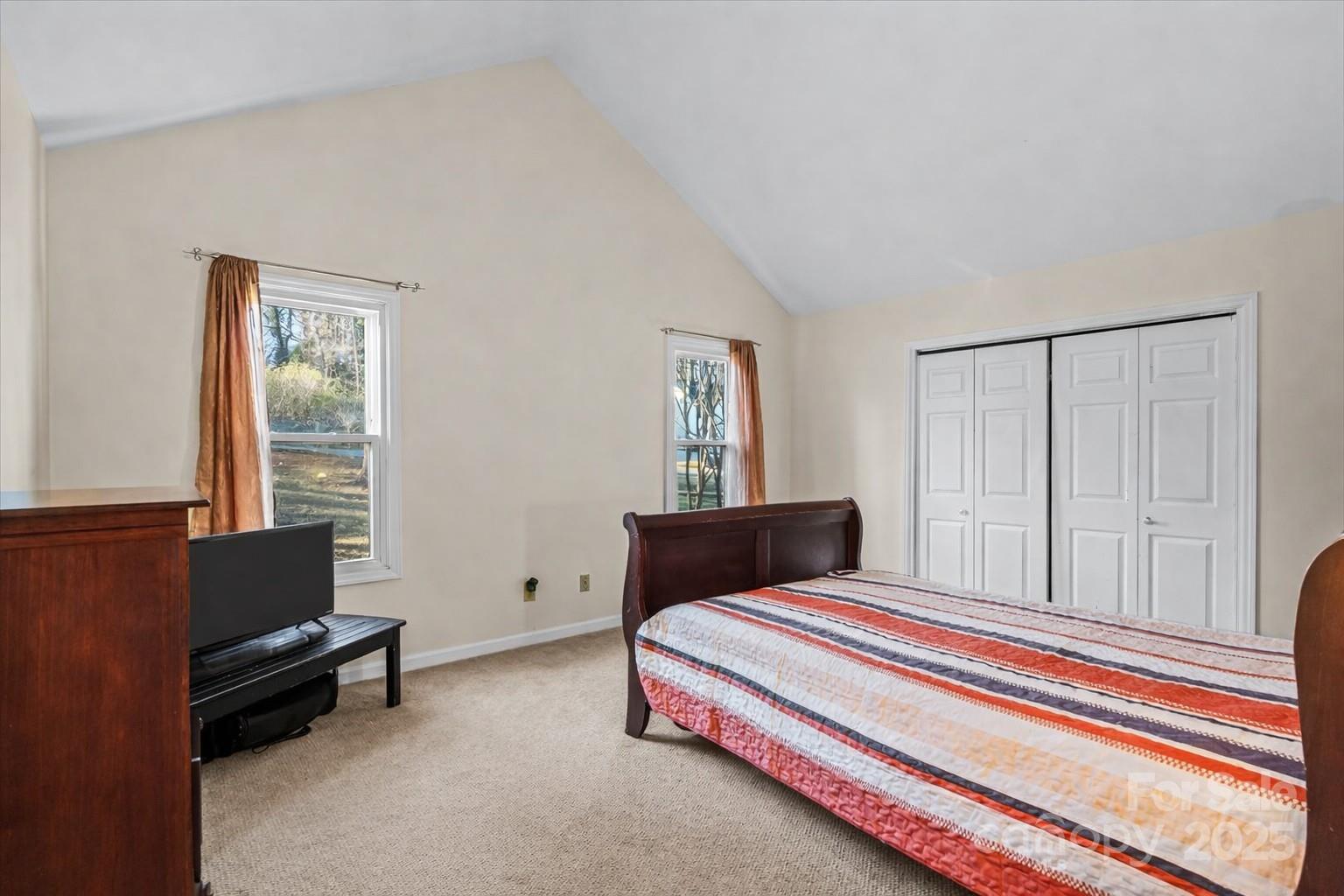 7022 Plott Road Charlotte, NC 28215 - Photo 21 of 27 a bedroom with furniture and windows