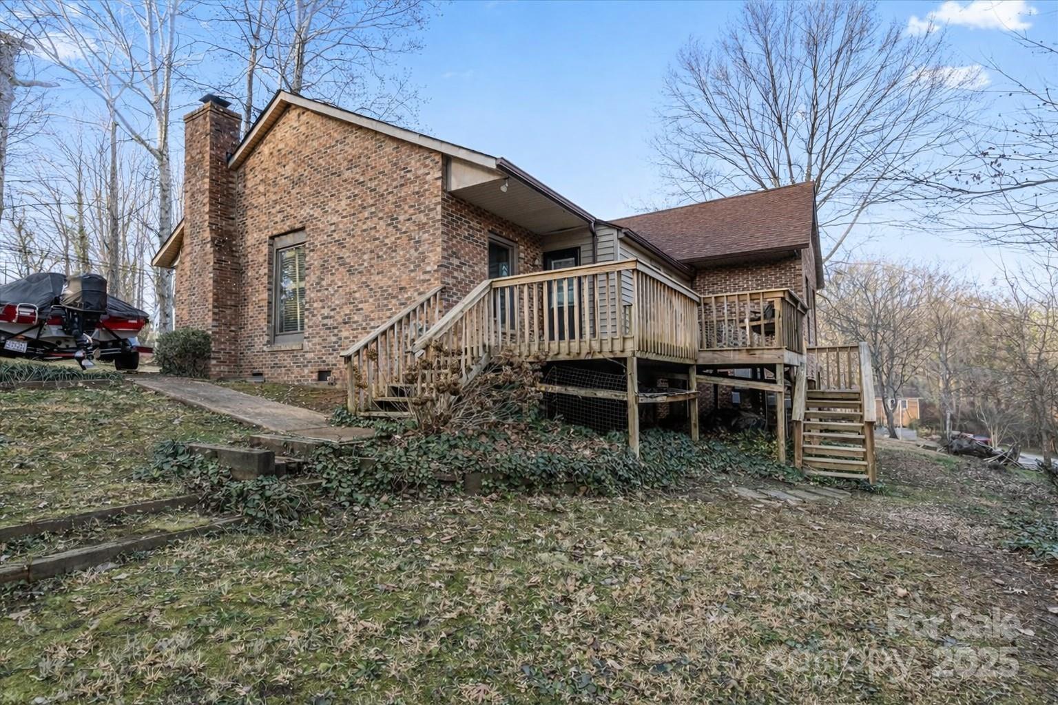 7022 Plott Road Charlotte, NC 28215 - Photo 25 of 27 a view of a house with a yard and wooden fence