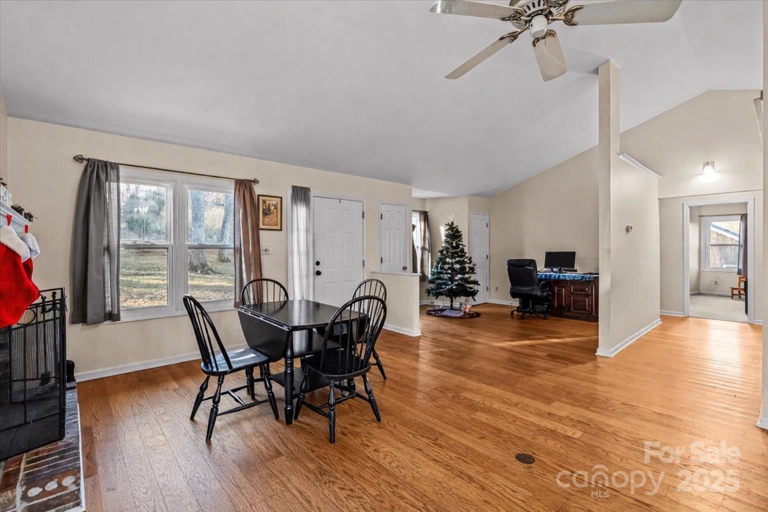 7022 Plott Road Charlotte, NC 28215 - Photo 3 of 27 a view of a dining room with furniture and wooden floor