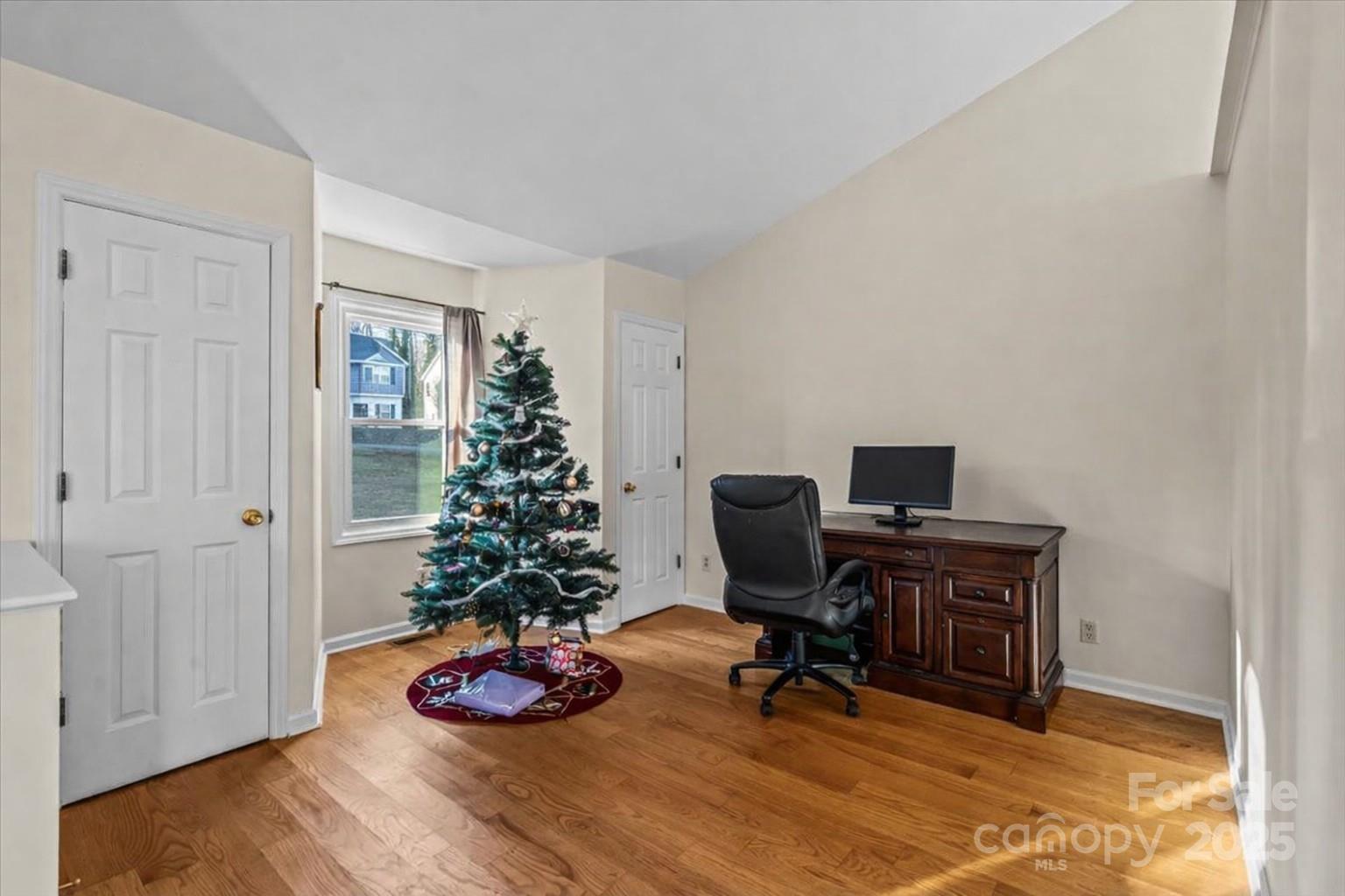 7022 Plott Road Charlotte, NC 28215 - Photo 4 of 27 a view of a workspace with furniture and a window