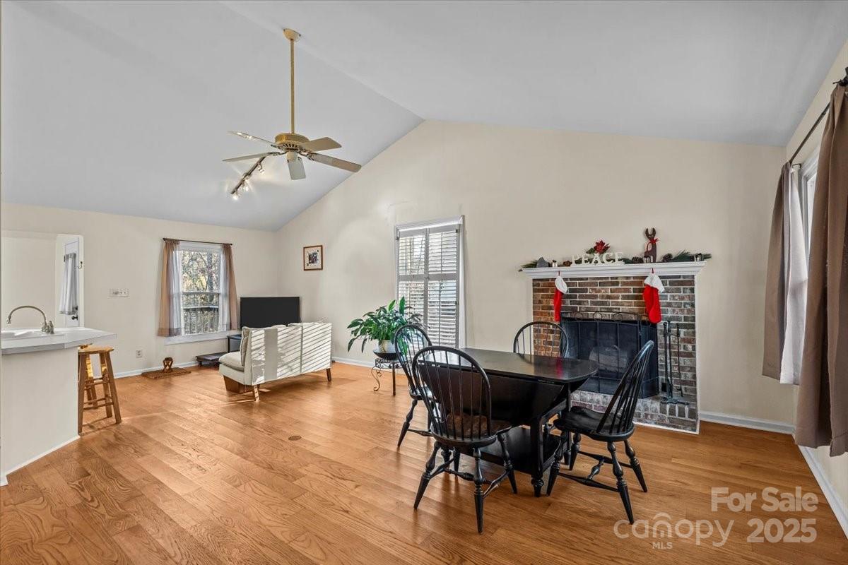 7022 Plott Road Charlotte, NC 28215 - Photo 5 of 27 a view of a dining room with furniture wooden floor and a chandelier