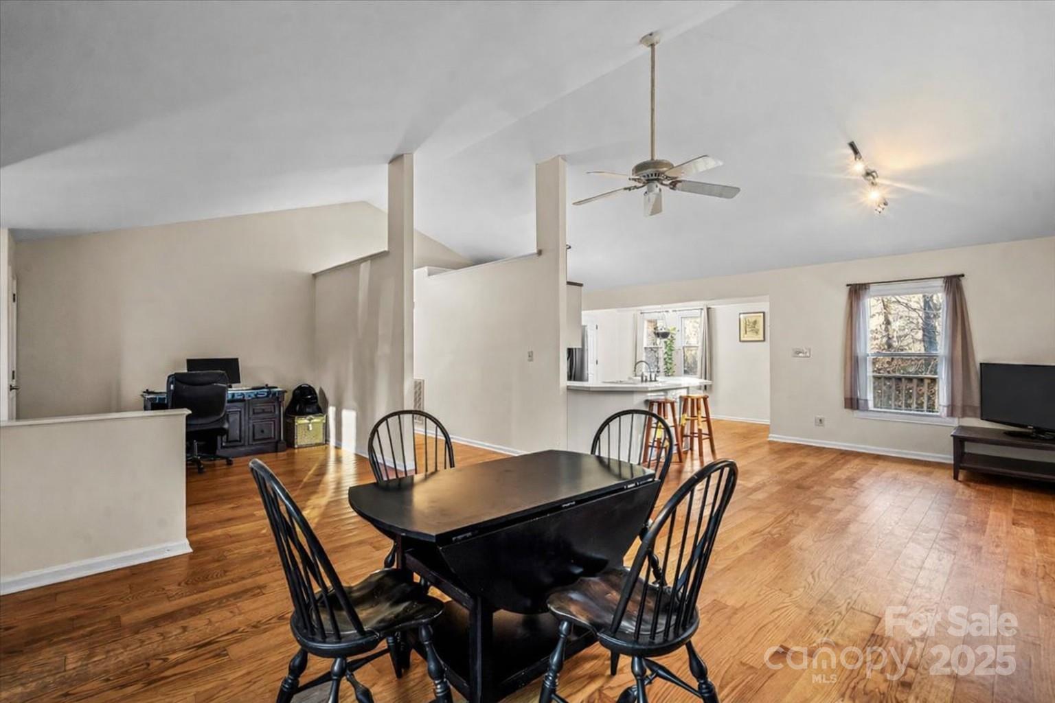 7022 Plott Road Charlotte, NC 28215 - Photo 6 of 27 a view of a a dining room with furniture window and wooden floor