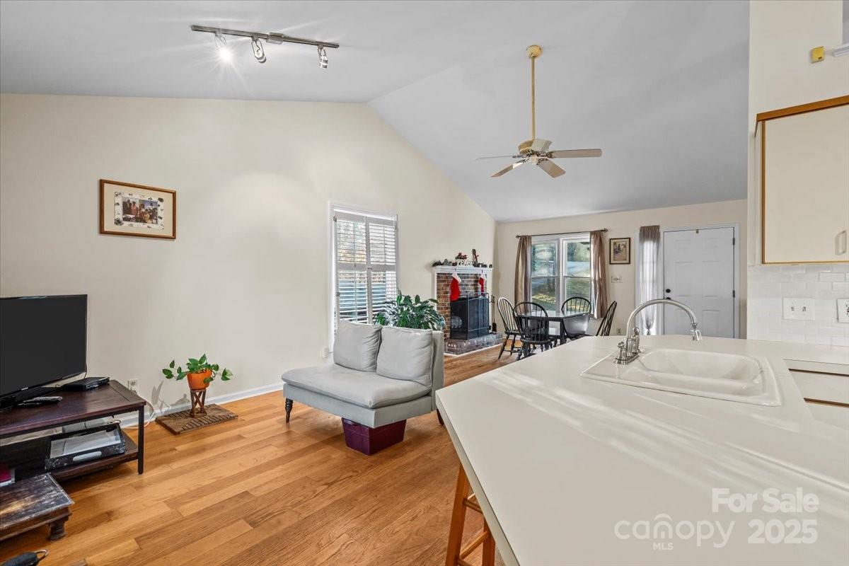 7022 Plott Road Charlotte, NC 28215 - Photo 7 of 27 a spacious bedroom with a bed and a couch