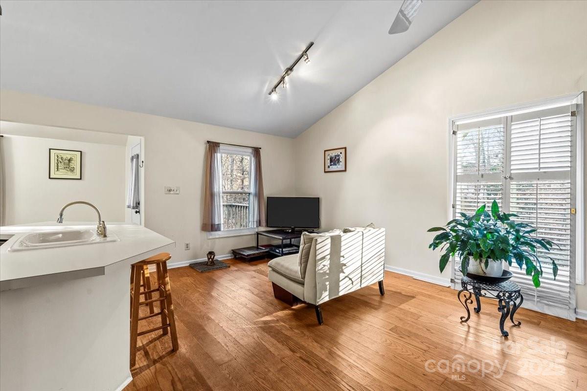7022 Plott Road Charlotte, NC 28215 - Photo 8 of 27 a living room with furniture and a potted plant