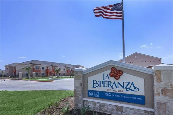 a front view of a building with sign board