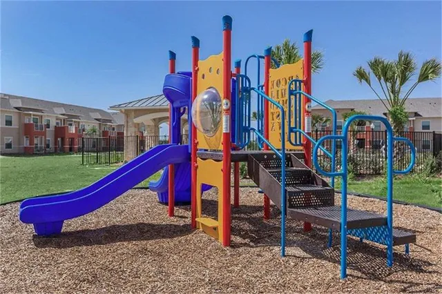 a view of a houses with pool and chairs