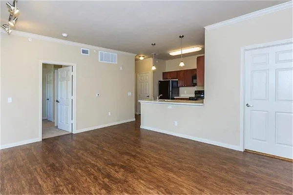 a view of a kitchen with a microwave and cabinets