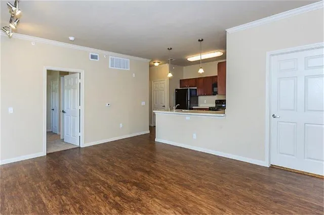 a view of a kitchen with a microwave and cabinets