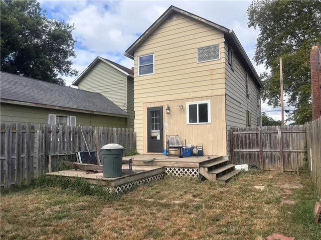 a view of backyard with seating space