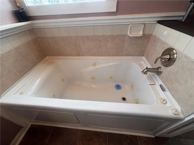 a bathroom with a bathtub and a sink