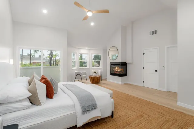 a bedroom with furniture and a fireplace