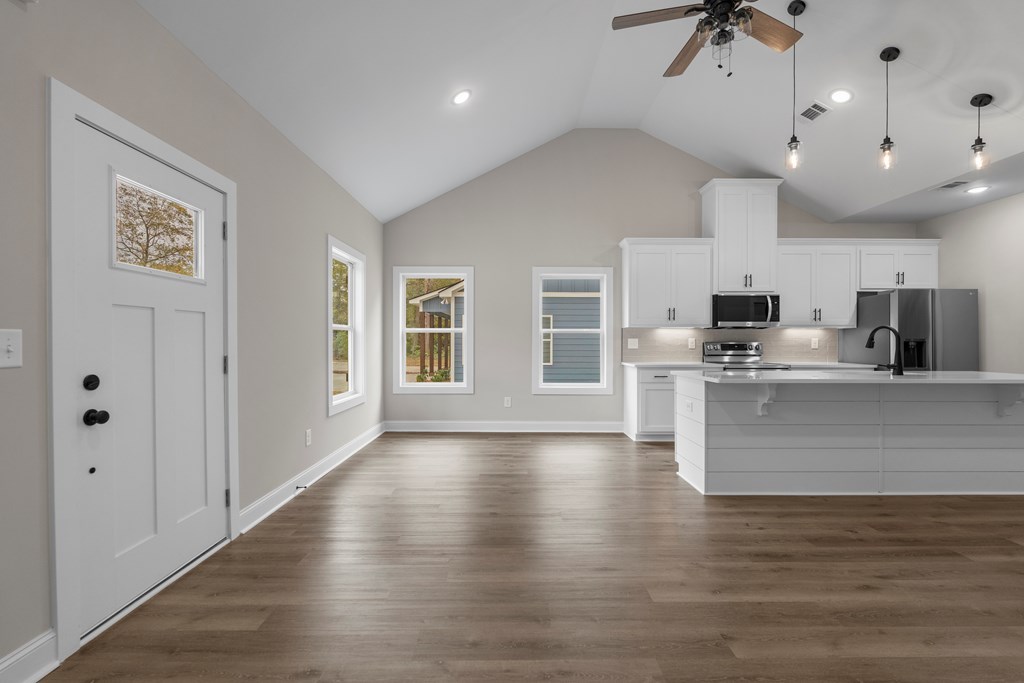 308 Burns Avenue Pine Mountain, GA 31822 - Photo 6 of 17 a view of kitchen with stainless steel appliances kitchen island granite countertop a stove a sink a refrigerator and white cabinets with wooden floor