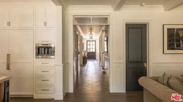 a kitchen with stainless steel appliances granite countertop a kitchen island a stove and a cabinets