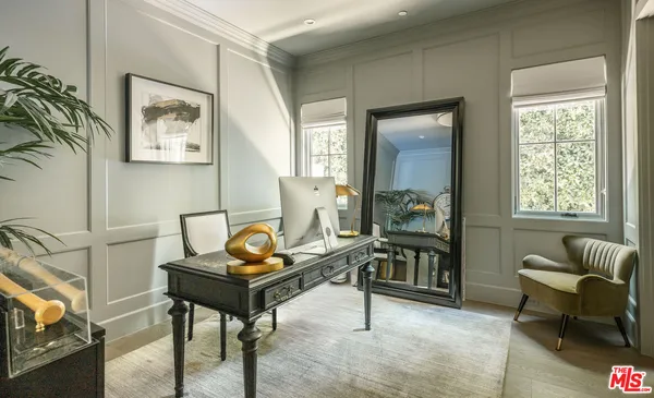 a view of a hallway to a window