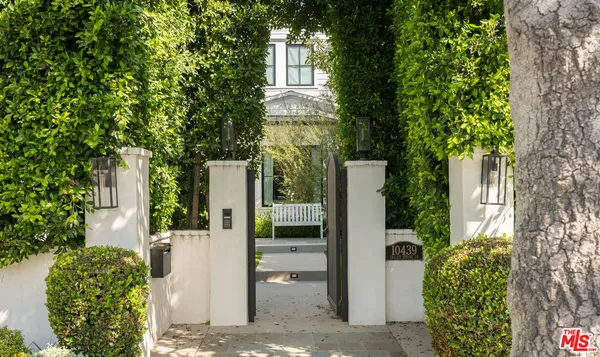 a view of a house with a tree