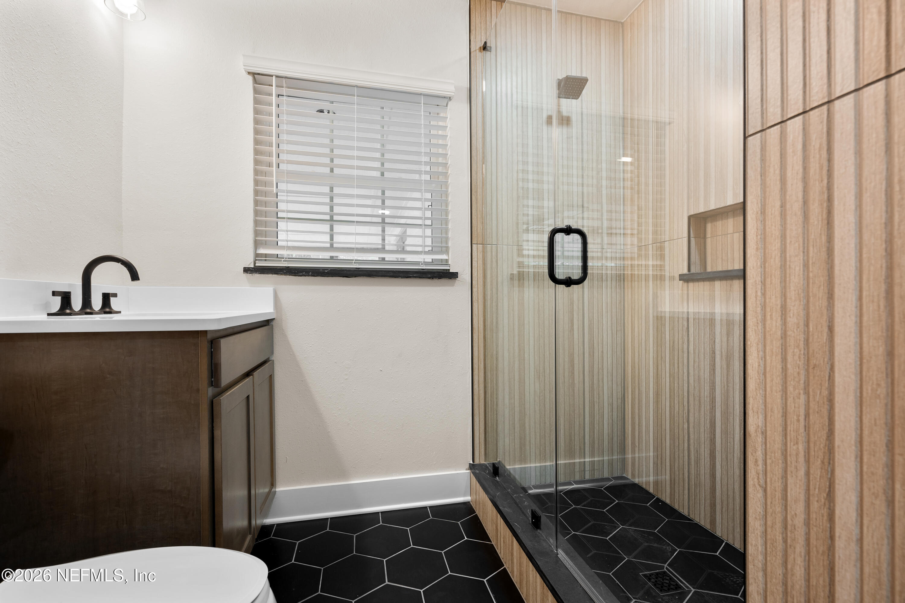 1241 Hibiscus Street St. Augustine, FL 32084 - Photo 17 of 27 a bathroom with a granite countertop sink toilet and shower