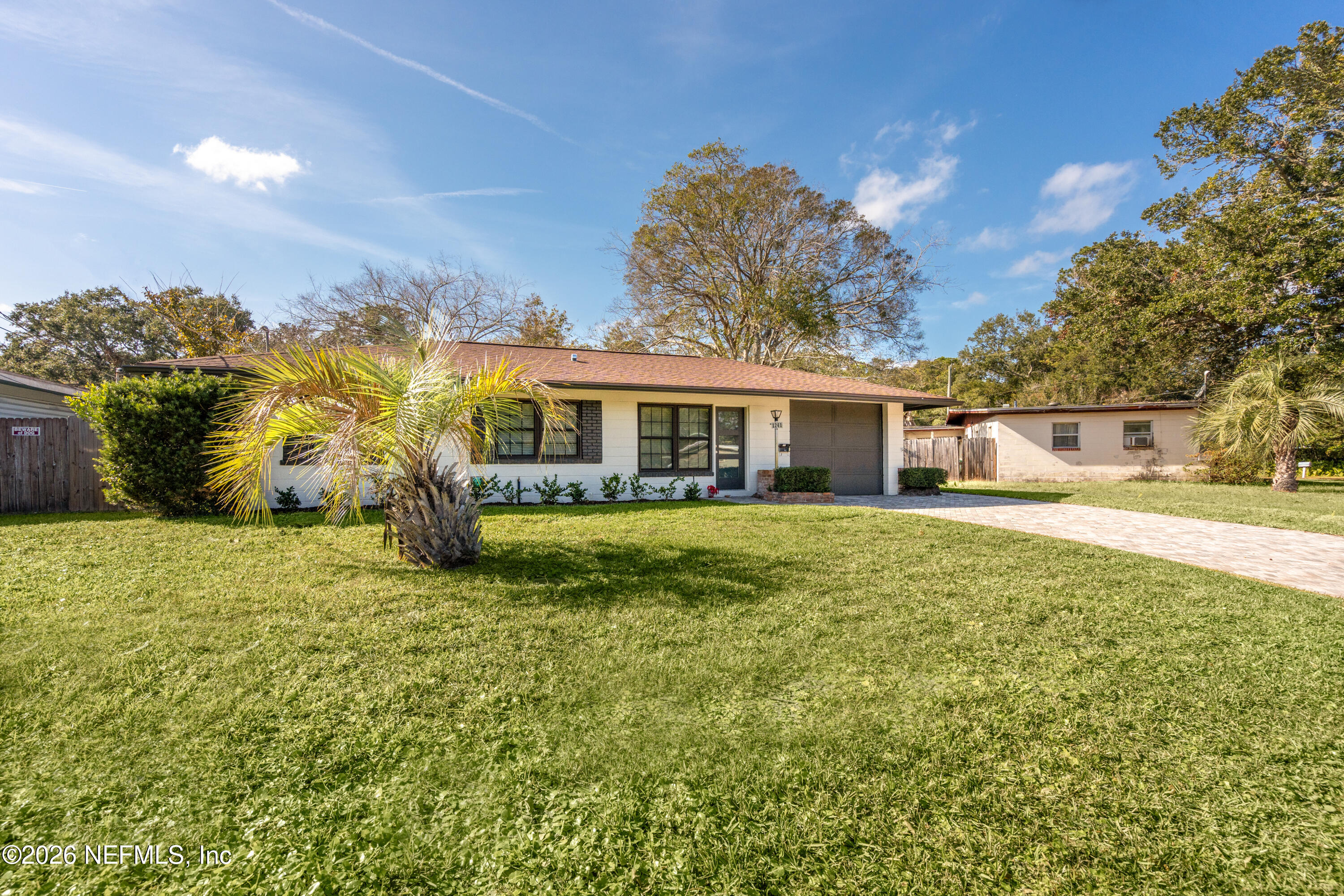 1241 Hibiscus Street St. Augustine, FL 32084 - Photo 2 of 27 a front view of house with yard and green space