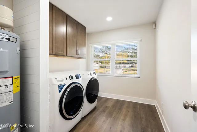 a view of a kitchen with washer and dryer